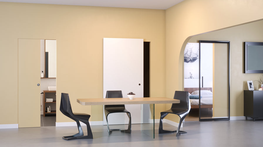 Arredo Porte Italiane, tavolo sospeso e porta magical con binario nascosto